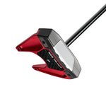 Red and black golf putter on a white background